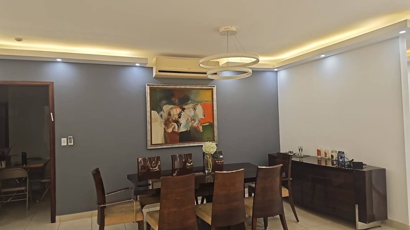 Spacious hallway with built-in closets, tile flooring and recessed lighting in remodeled condo PH Metropolitan Park Obarrio