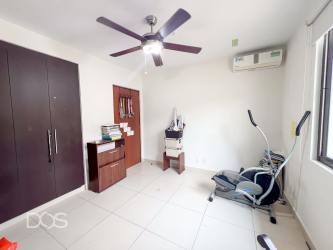 Modern open kitchen with granite countertops and cabinetry in River Valley Panama Pacifico house for sale