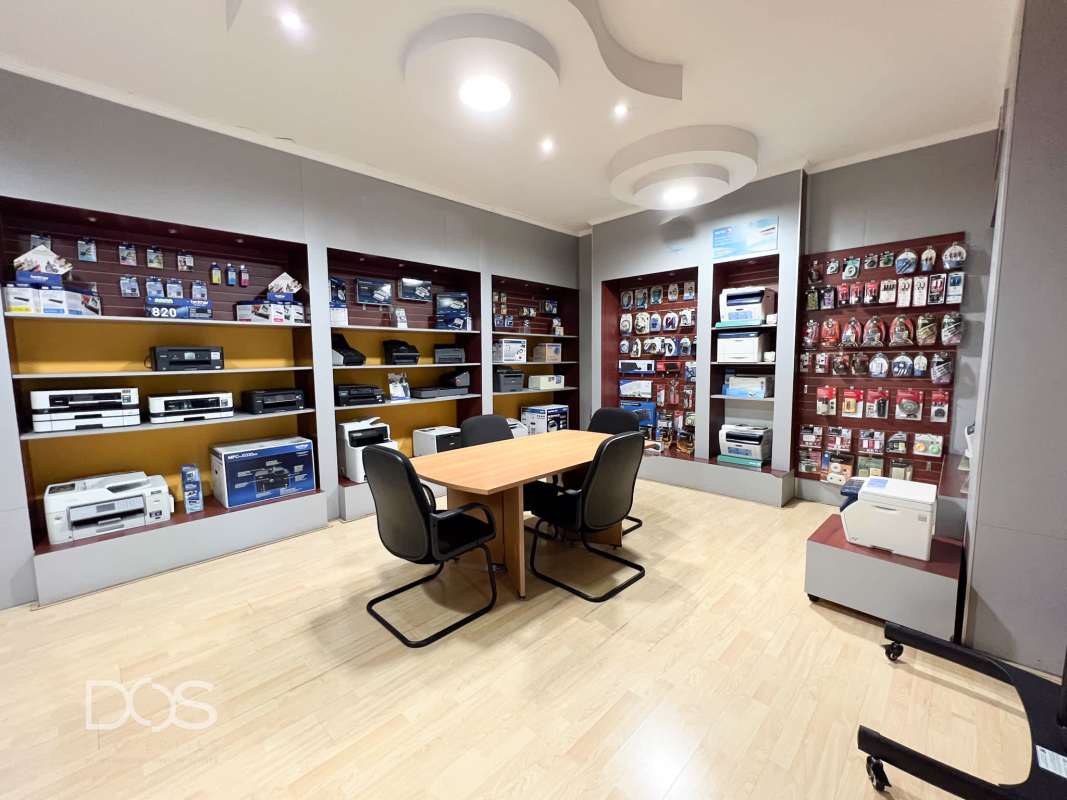 Reception lobby with sofa, display racks and glass office partition in Panama commercial space