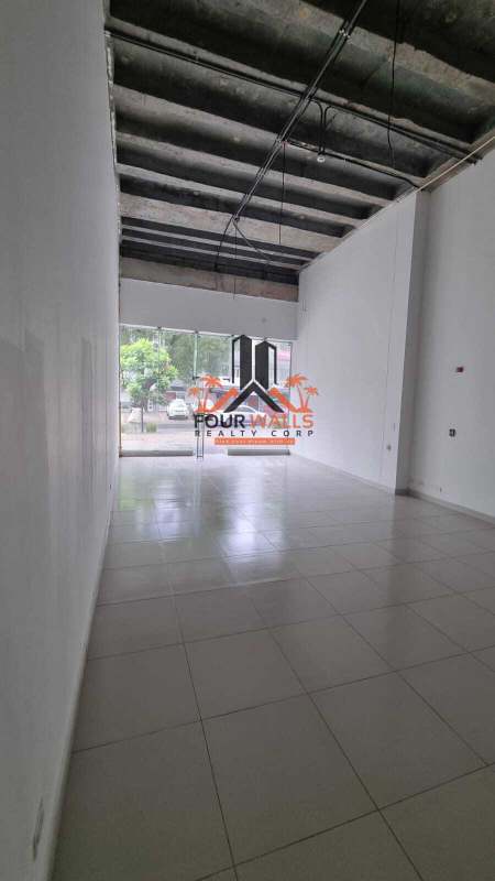 Interior of empty commercial unit with exposed ceiling, tiled floor in PH Lemon Tower Bella Vista