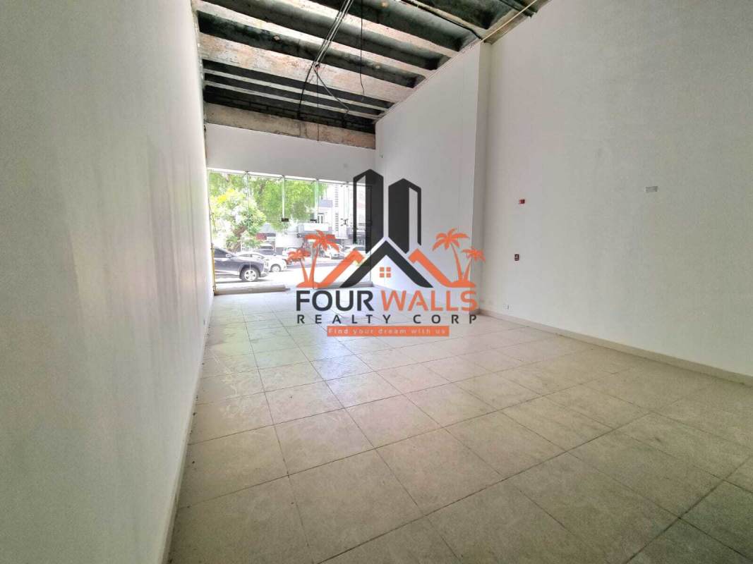 Glass retail storefront in PH Lemon Tower Bella Vista with clear entry and large windows