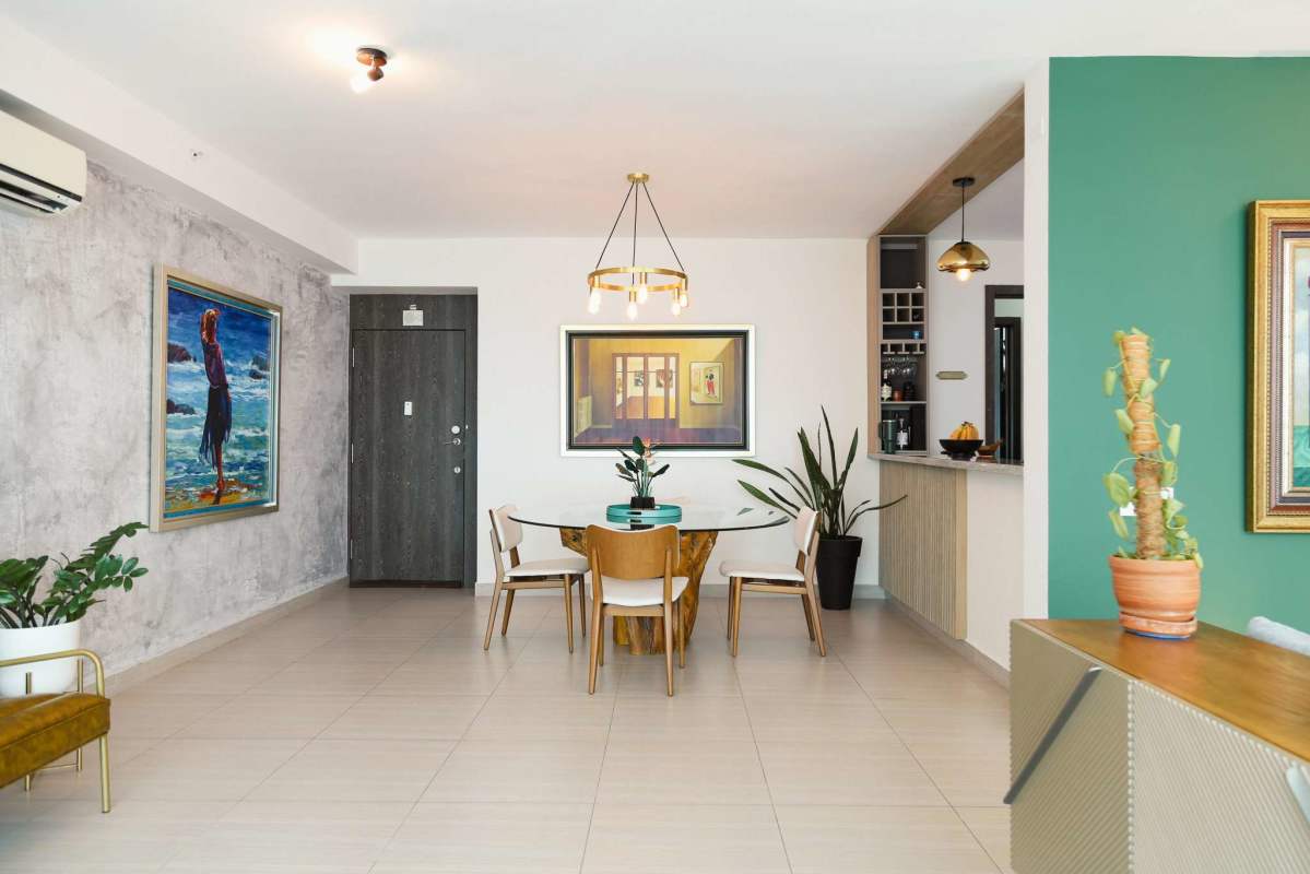 Modern living room with panoramic ocean view, large windows in PH Asia Costa del Este Panama