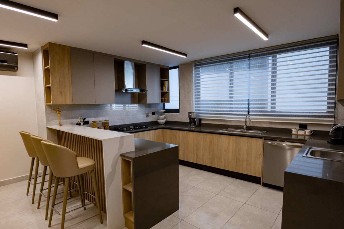 Modern living and dining room with marble floors and skyline view PH Paitilla Court Panama