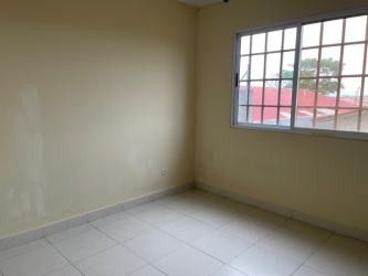 Bedroom with tiled floors, window security bars in Monte Limar house