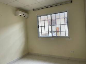 Community entrance gate with security booth at Monte Limar La Chorrera