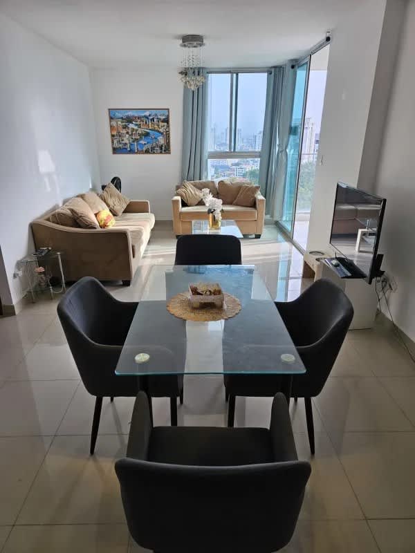 Bright furnished living dining room with city view in Residencias del Sol Carrasquilla Panama