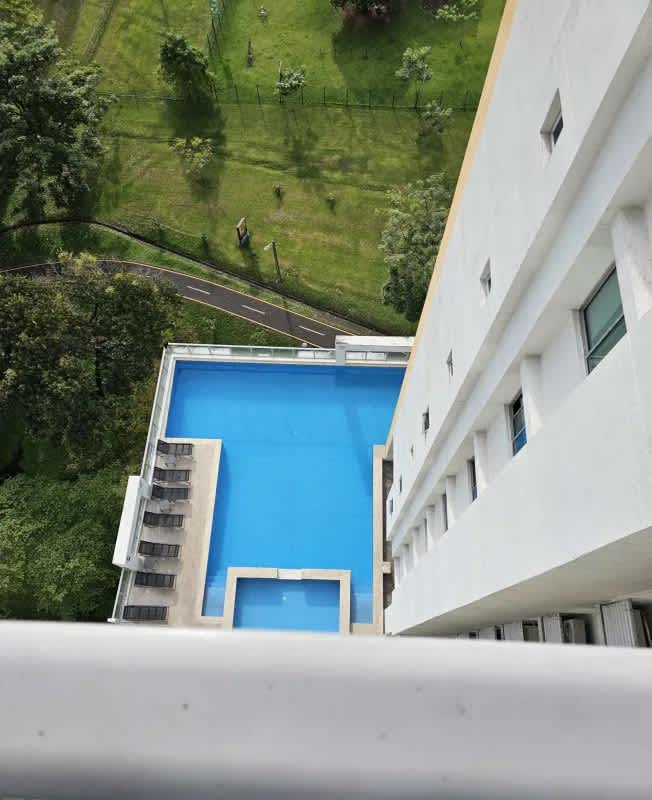 Panoramic aerial of swimming pool recreation deck green park Residencias del Sol Panama