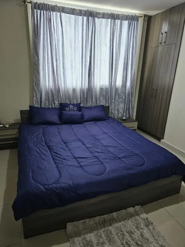 Spacious primary bedroom with closet air conditioning in Residencias del Sol Panama