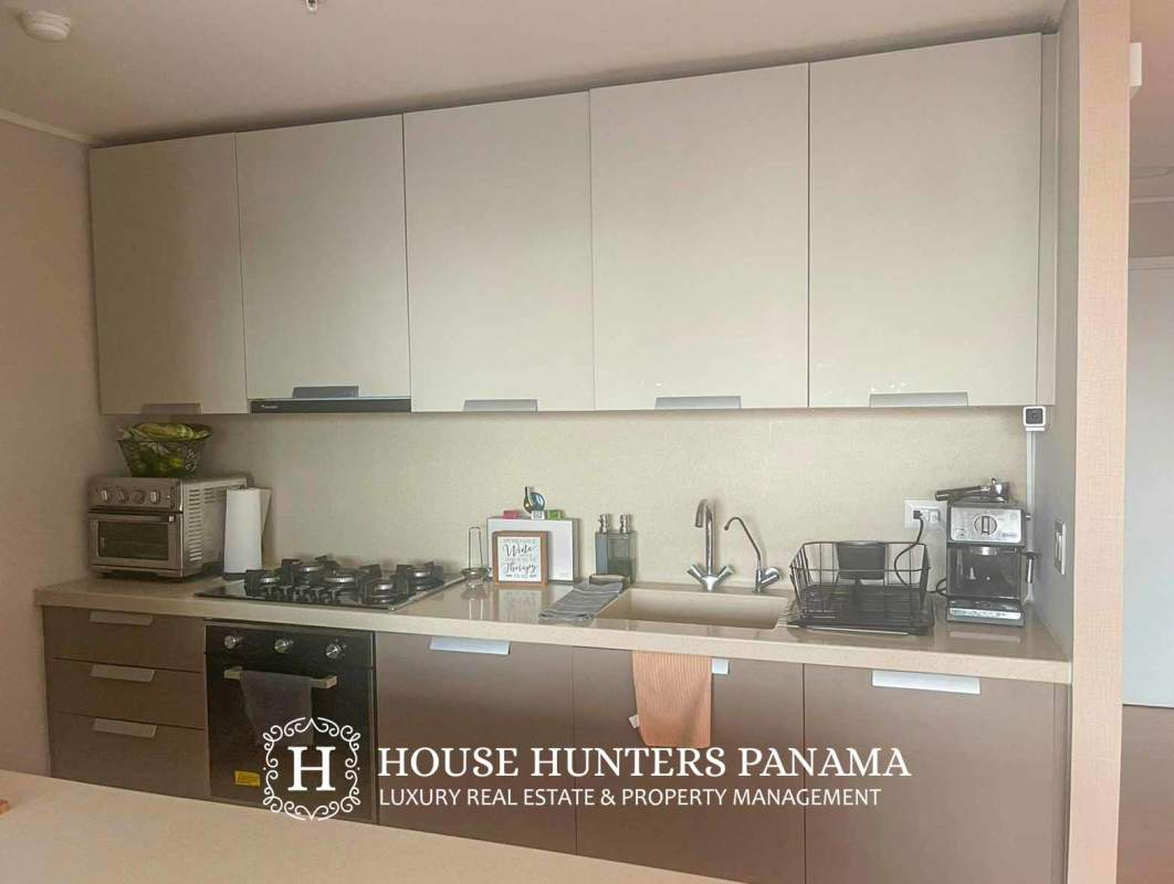 Modern bathroom with vanity glass enclosed shower decorative tile in Panama condo
