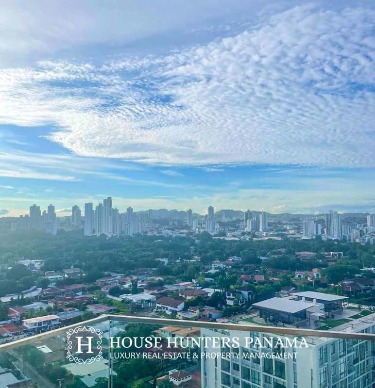 Covered balcony with seating and panoramic views in Coco del Mar Tower Panama City