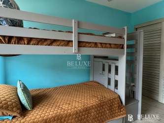 Resort-style swimming pool with palm trees at PH Ventanas del Mar Panama