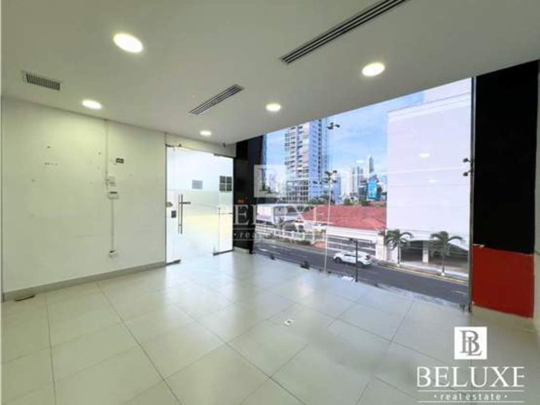 Modern commercial unit interior with glass walls and tiled floor in Panama City
