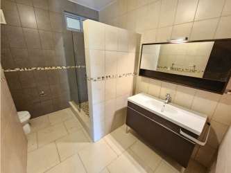 Walk-in shower and tile walls modern bathroom PH Soleo Panama Pacifico