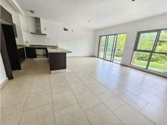 Spacious kitchen living room area with beige tile large windows PH Soleo Panama Pacifico
