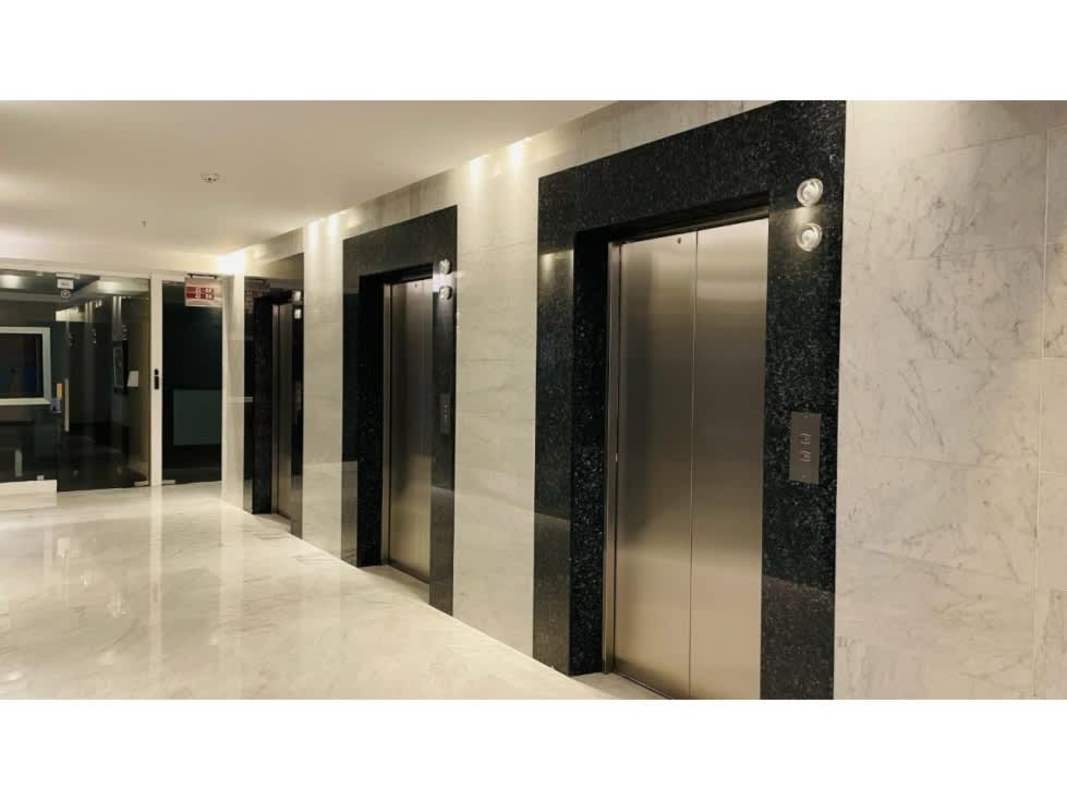 Reception area with glass doors inside modern Torre Ancón office space in Costa del Este