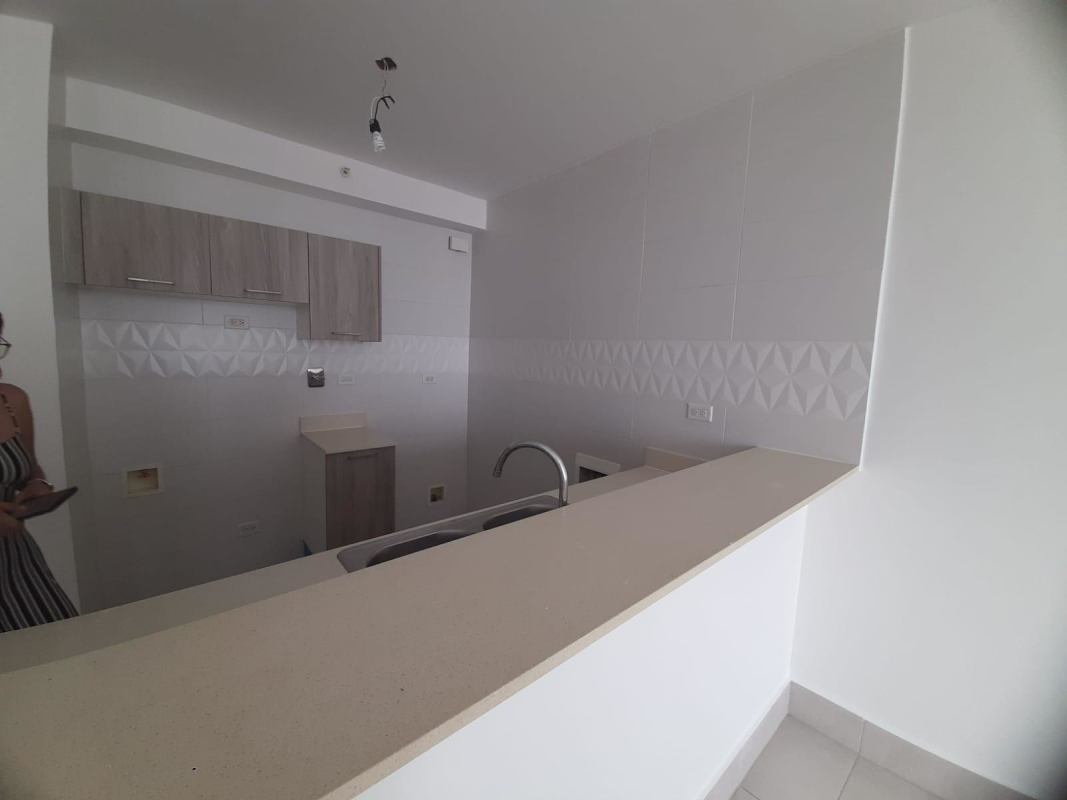 Light wood cabinetry kitchen with ceramic tile backsplash at PH Vivendi Green Betania Panama