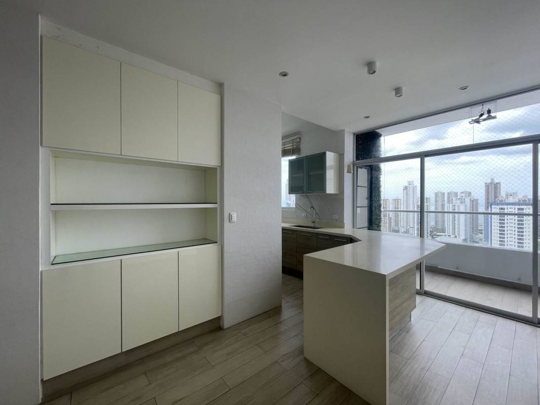 Remodeled kitchen with breakfast bar, built-in oven, induction stove and large windows at PH South Coast