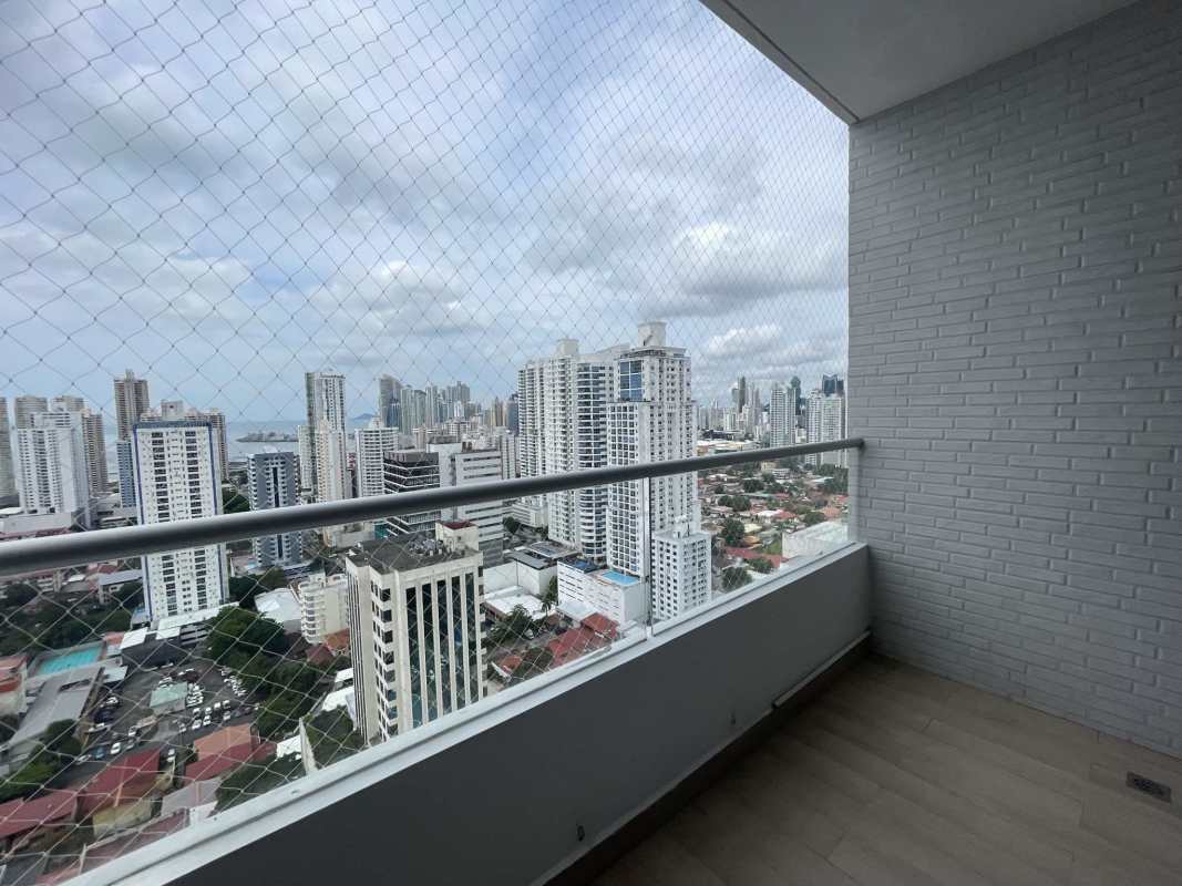 Large balcony with glass railing offering panoramic Panama Bay and skyline views at PH South Coast San Francisco