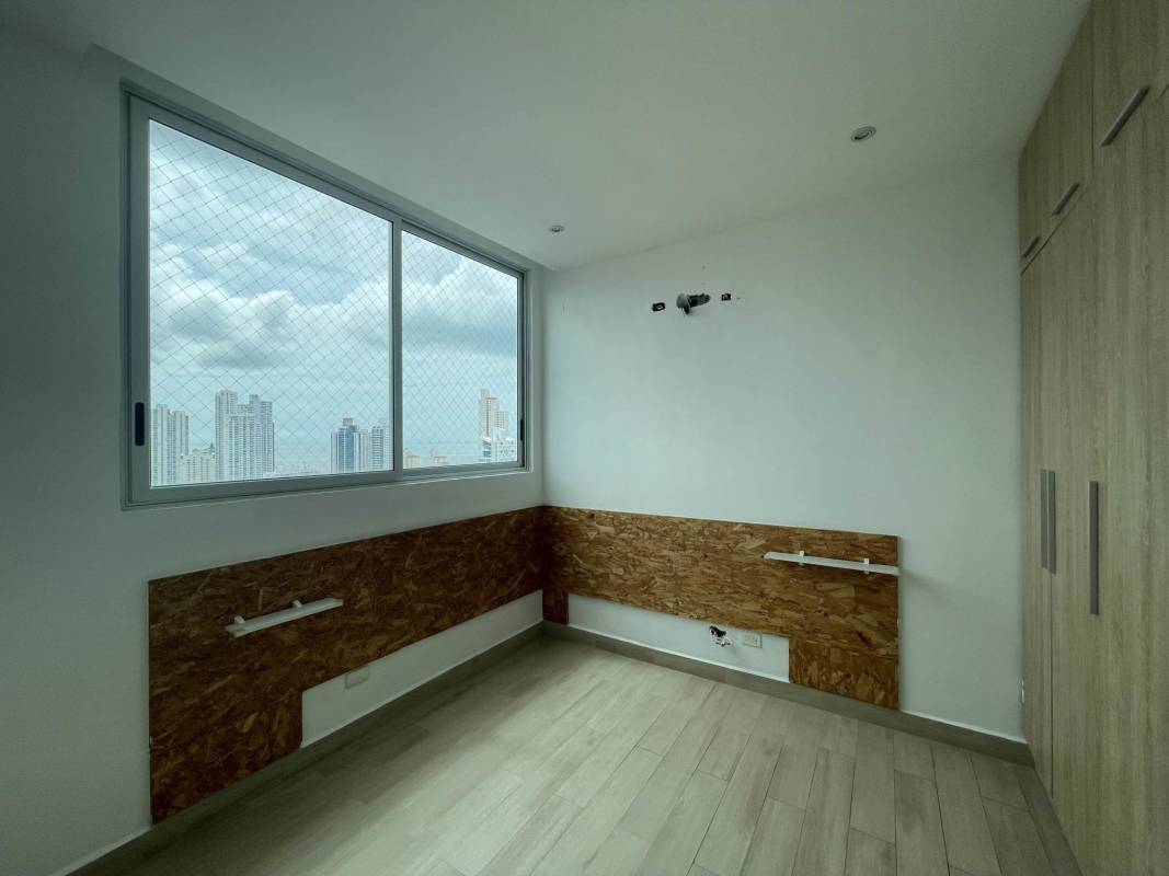 Spacious bedroom with large window overlooking ocean and cityscape PH South Coast San Francisco Panama