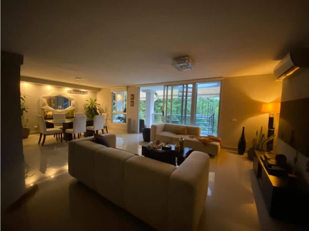 Spacious open-plan living room with terrace access and garden views