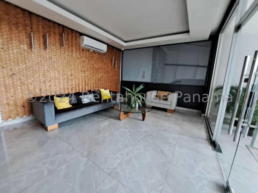 Furnished open living dining with AC wall-mounted TV PH Sky Blue Tower San Francisco