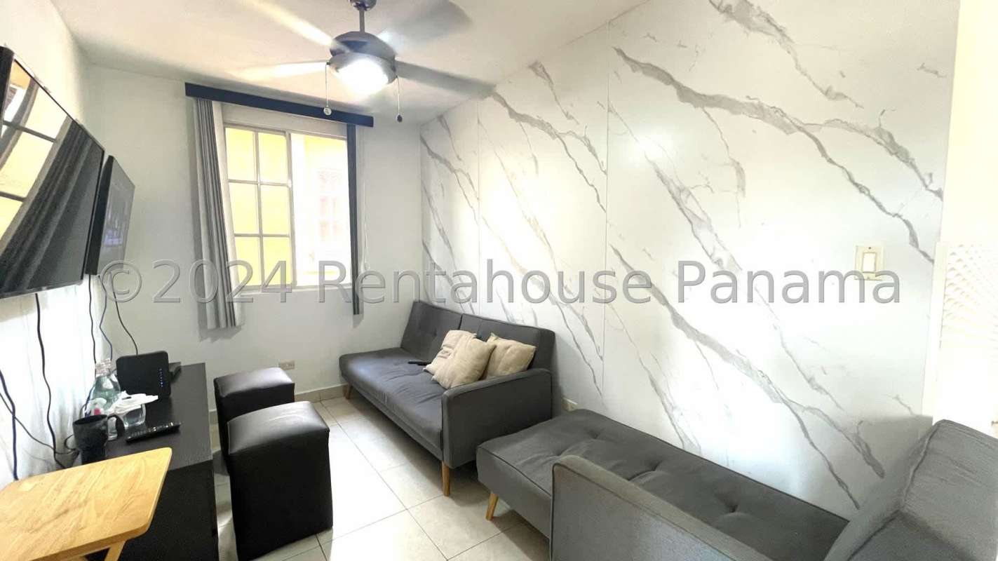 Bedroom with natural light, neutral tones, closet PH Dorado Lakes Condado del Rey