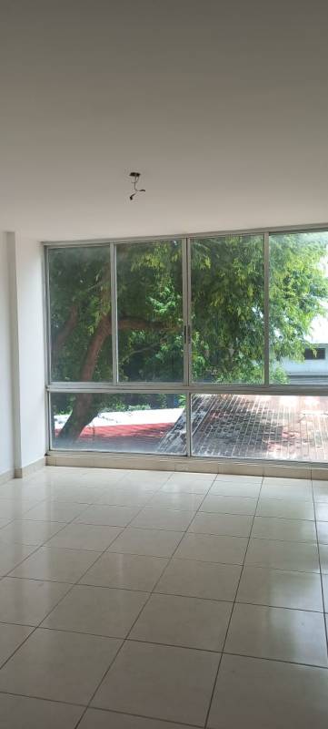Living room area with large windows in PH El Ingenio Gardens Panama City