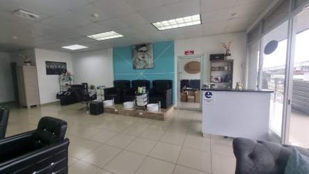 Salon area with pedicure chairs reception counter tiled flooring large windows commercial unit Panama Oeste