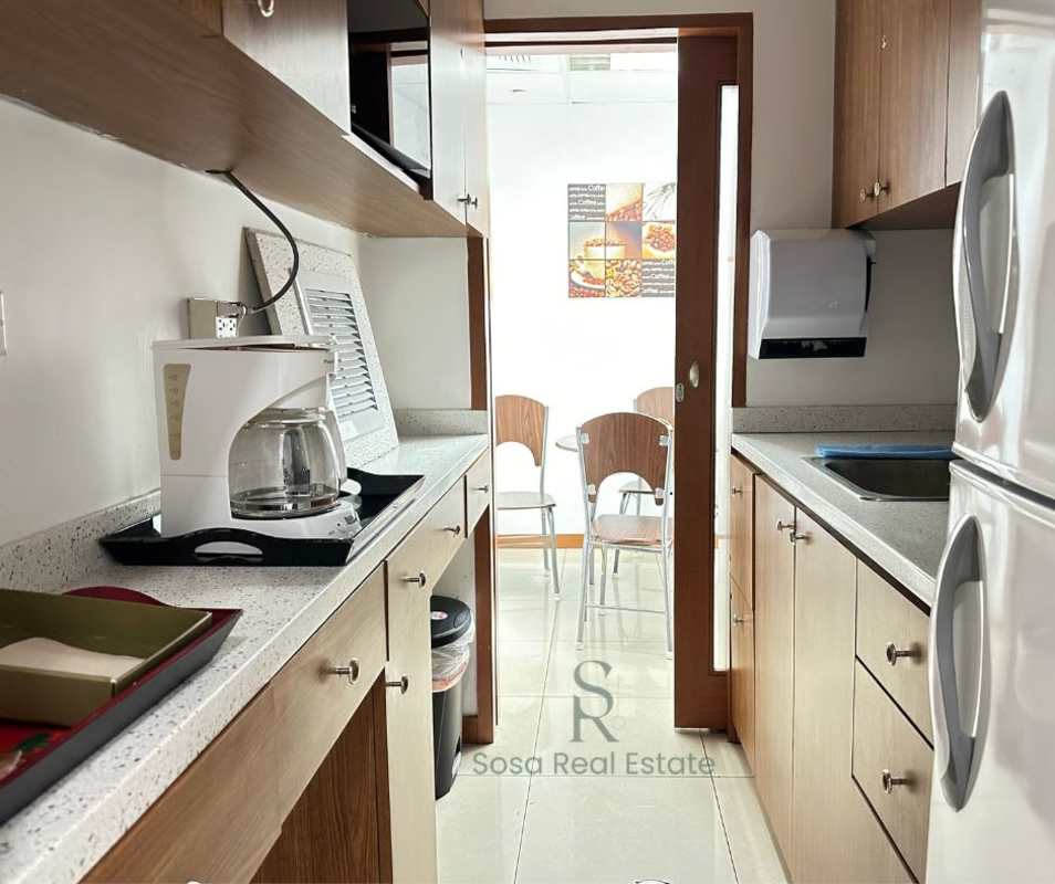 Glass door office corridor inside PH Molon Tower commercial building Obarrio Panama