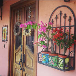 Rustic living room with stone wall, wooden furniture artisan house Penonomé Panama