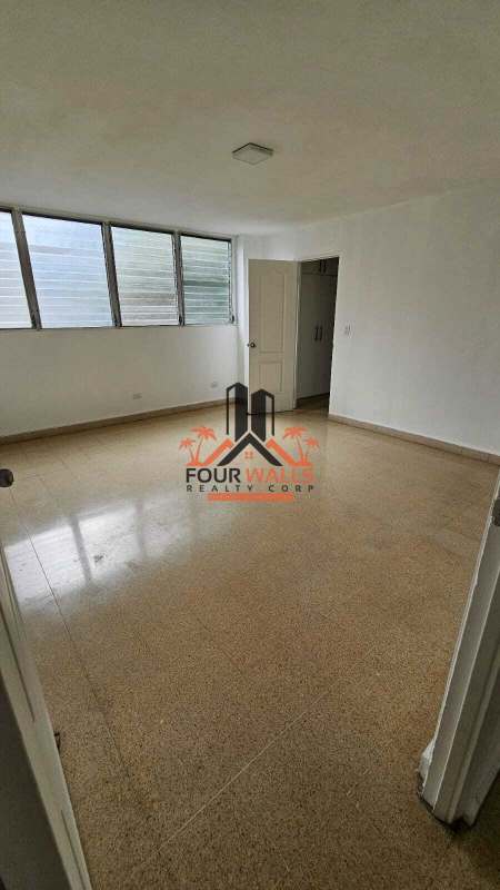 Kitchen space with granite counters and window at PH Costa del Sol Panama City