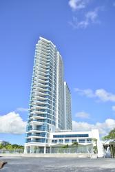 Modern beachfront tower with glass balconies and ocean views in Panama
