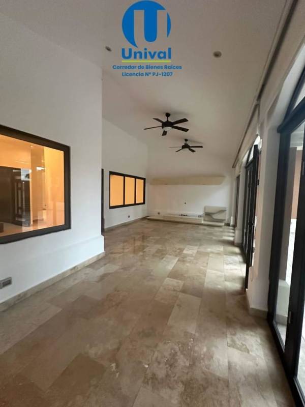 Modern kitchen with granite countertops and island in home Costa Sur Sunset Coast