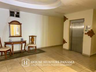 Lobby area with elevator and traditional decor at PH Valle del Río Boquete