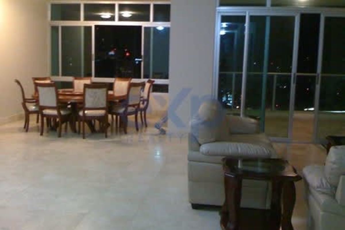 Elegant open concept living dining area with marble floors and large glass doors balcony PH Terrazas del Pacífico Panama