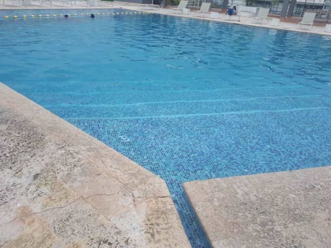 Fenced tennis court surrounded by greenery PH Alphes Brisas Norte Panama