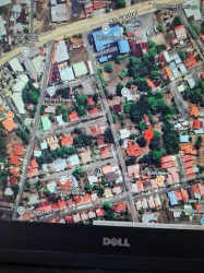 Aerial of Santiago Panama central neighborhood with development lot visible near Interamericana