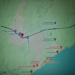 Team placing for sale sign on highway front Rio Hato commercial lot in Panama.