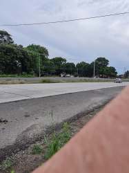 Street side of commercial lot with power poles and open land Rio Hato Panama.