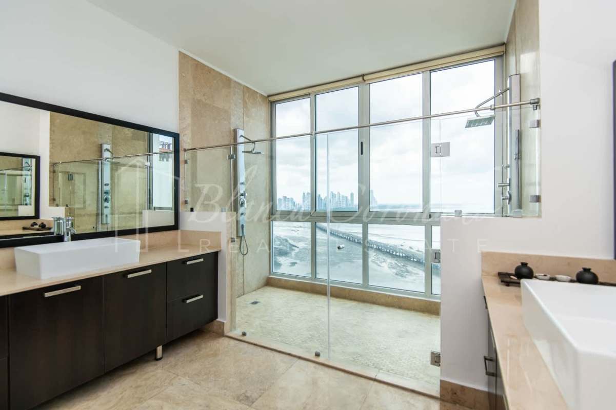 Luxury bathroom dual vanities glass walk-in shower ocean view PH Ocean Sky Panama