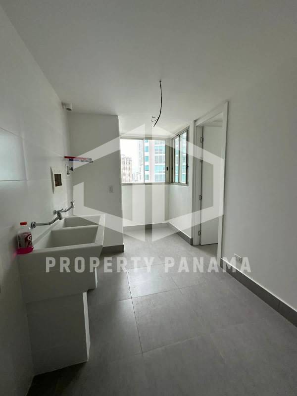 Bright open living room with floor-to-ceiling windows facing ocean PH Pacific Point Panama City