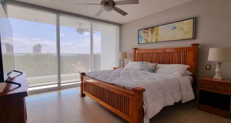 Sunlit guest bedroom with air conditioning tile flooring PH Royal Pacific Nueva Gorgona