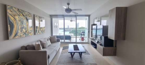Contemporary living room with large mirror, oceanfront balcony in PH Royal Pacific Gorgona Panama