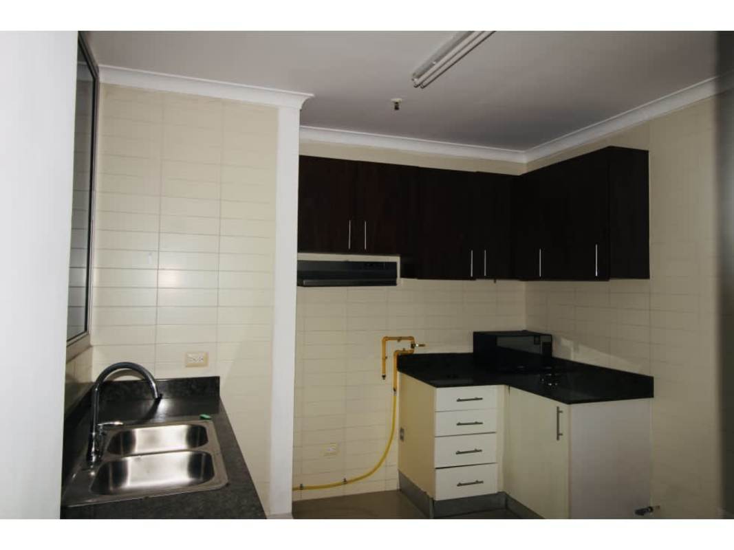 Spacious bedroom featuring large ocean view windows, AC and built-in closet in PH Waterview