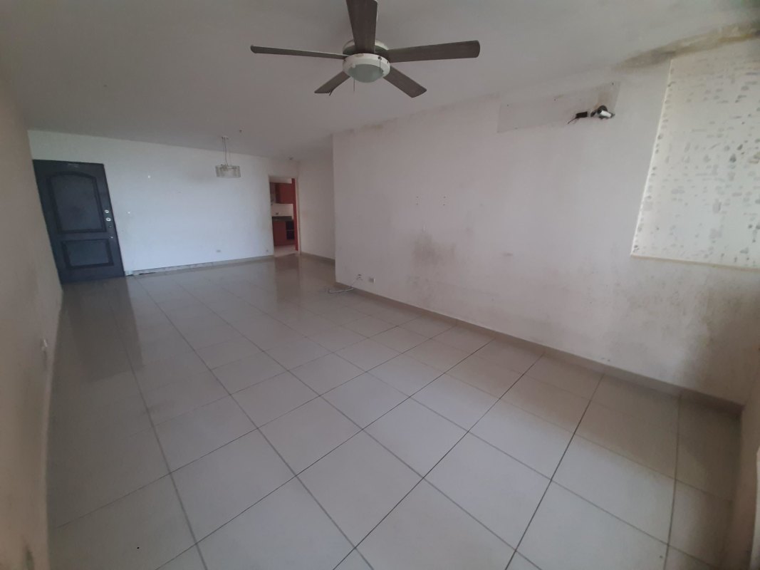 Empty living room porcelain tile floors ceiling fan window natural light PH San Francisco Bay Tower 200 Panama