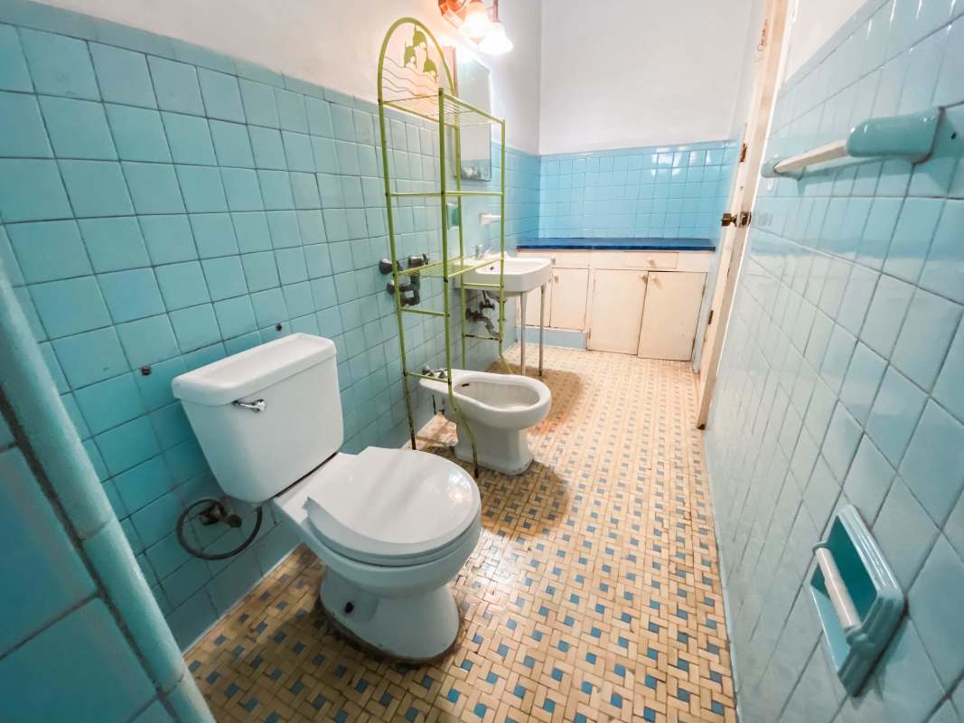 Bathroom with light blue vintage tiles, sink, bidet and toilet in PH My Boy Panama City