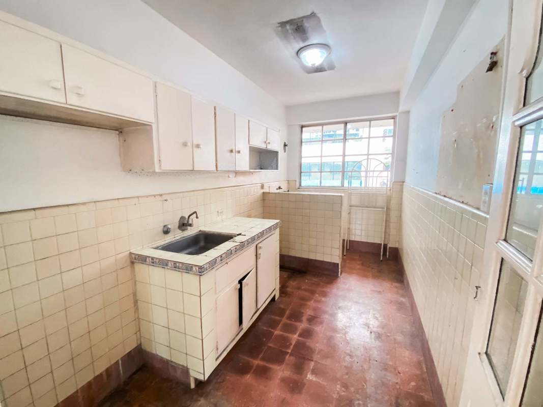 Traditional kitchen with tiled walls, window, cabinets PH My Boy Panama City