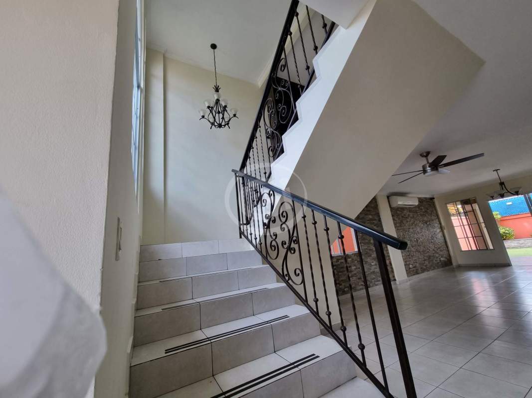 Spacious kitchen with granite counters, wood cabinets, appliances and breakfast nook in PH Castel Novo Panama City