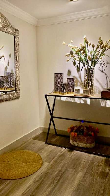 Entertainment room with sectional sofa, TV, art and guitars in La Alameda Villa de las Fuentes