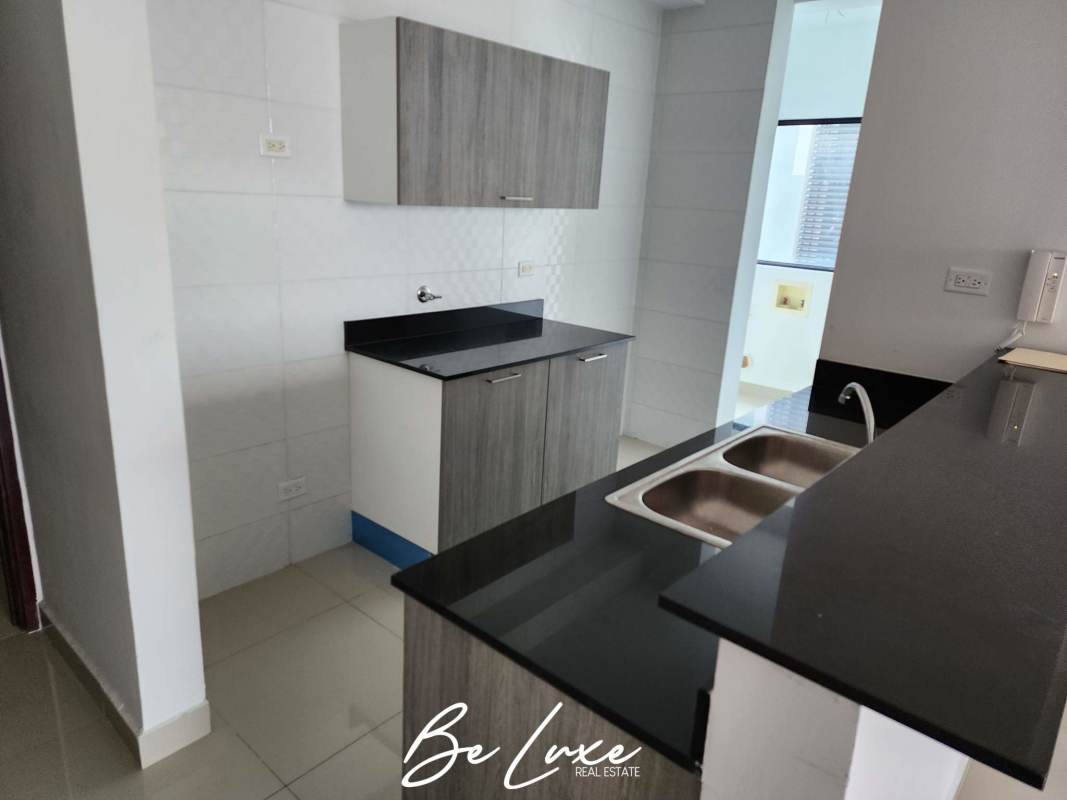 Contemporary kitchen black granite countertop porcelain floor PH Canvas Tower Parque Lefevre Panama